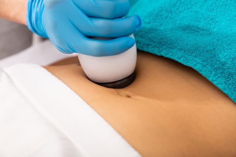 Needleless mesotherapy hardware procedure on female belly